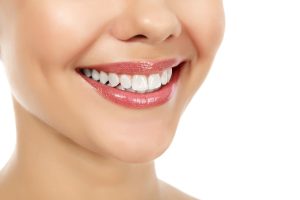 Young smiling woman, white background, copyspace